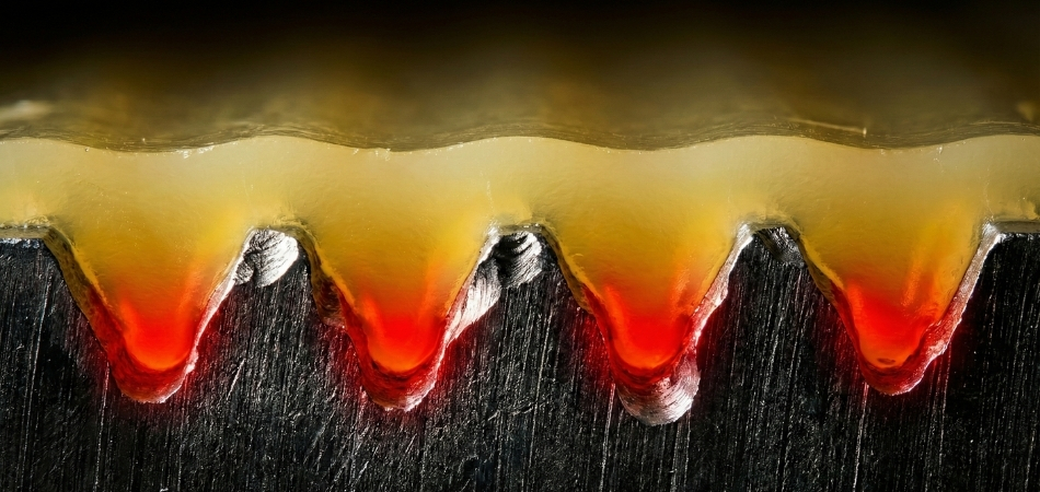 Cross-section illustrating how deep texture requires extra draft angle to prevent drag marks.
